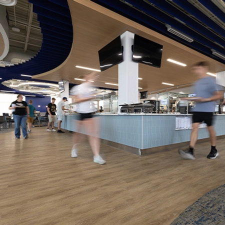 Students walking in the newly renovated Larson Commons.