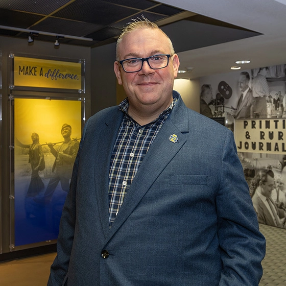 Director of the School of Communication and Journalism, Josh Westwick, poses in Yeager Hall.