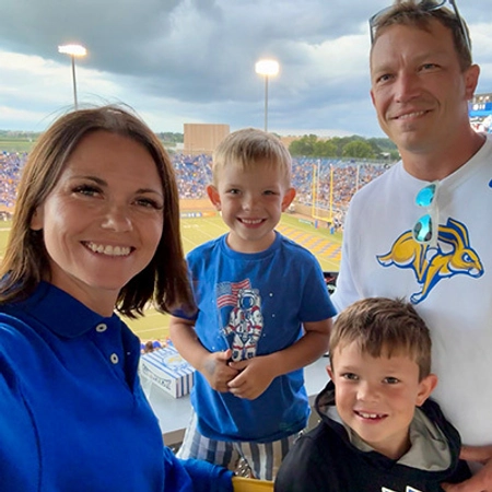 Members of the Ramsdell family smile together in the suites of the Dana J. Dykhouse Stadium.