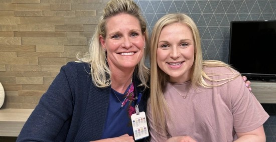 Erica DeBoer and Madison Fitch sitting side by side at a table.