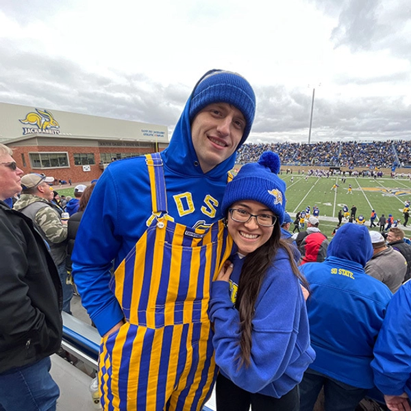 Nick and his wife at an SDSU football game at Dana J. Dykhouse stadium.