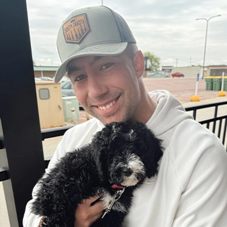 A photo of Trey and his dog, Bennie.