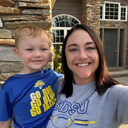 Kayla Schinkel smiles with her young son