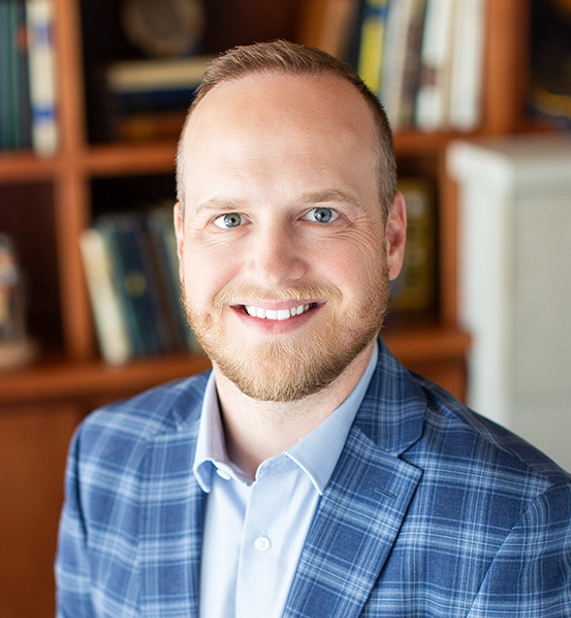 professional headshot of Travis Jensen