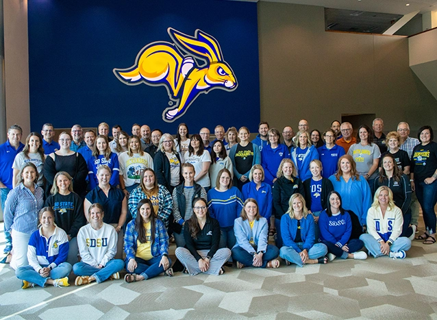 The SDSU Alumni & Foundation team get together with athletics development staff for a large group photo.