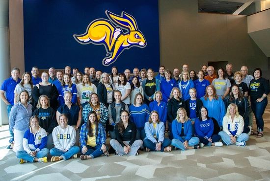 The SDSU Alumni & Foundation team get together with athletics development staff for a large group photo.
