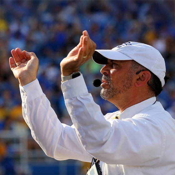 Kevin Kessler conducts The Pride of the Dakotas Marching Band.
