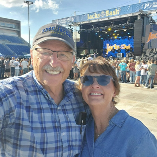 Gary and Donna Dettman smiling for a selfie at Jacks Bash 3.