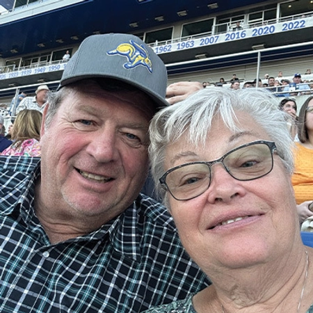 Randy and Cindy Frederick taking a selfie at Dana J. Dykhouse stadium