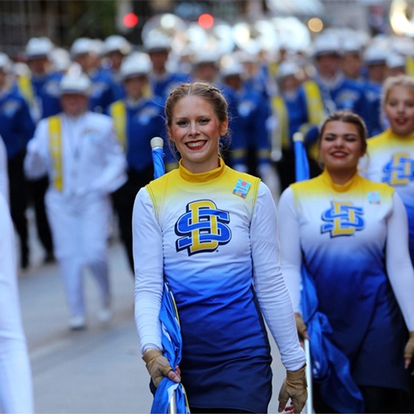 Hannah Hank smiles while marching in the Macy's Thanksgiving Day Parade.