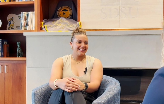 Alivya Bollen sitting and smiling during an interview