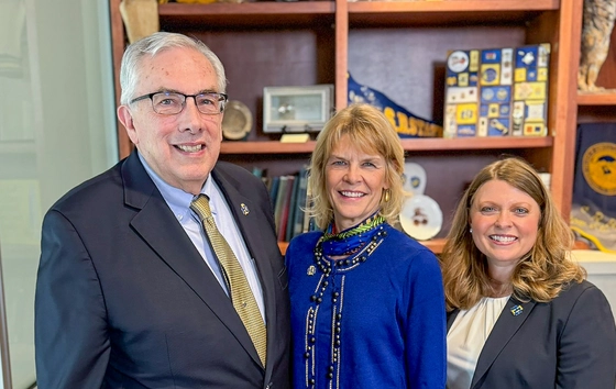 President Dunn, Kim Tyler, and Andi Fouberg together and smiling