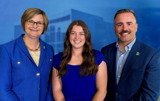 Michaela Willis, SDSU student Kelsey Swearinger, and Shawn Helmbolt smiling together at the camera